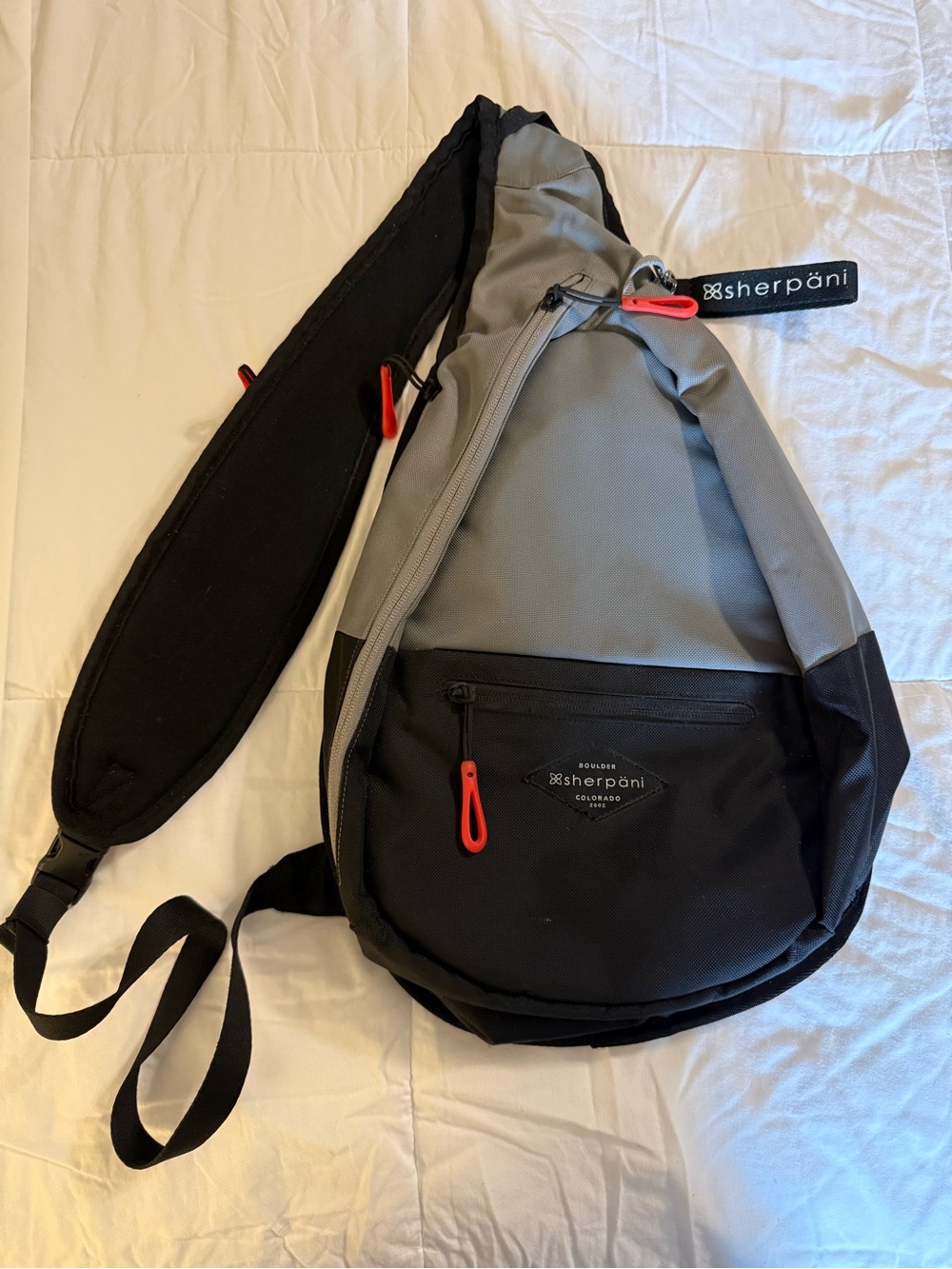 Sherpani Gray and Black Sling with Red Accents